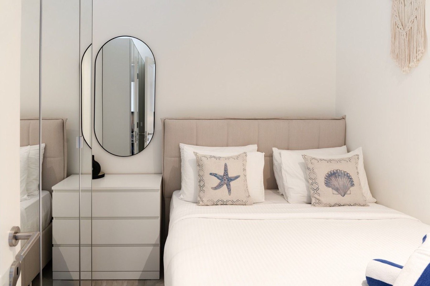 Marina Village 52 m² apartment, quiet bedroom with mirrored wardrobe
