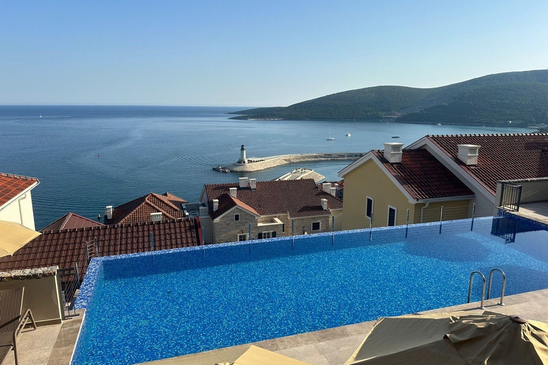 Marina Village communal pool with view onto the marina and Adriatic Sea