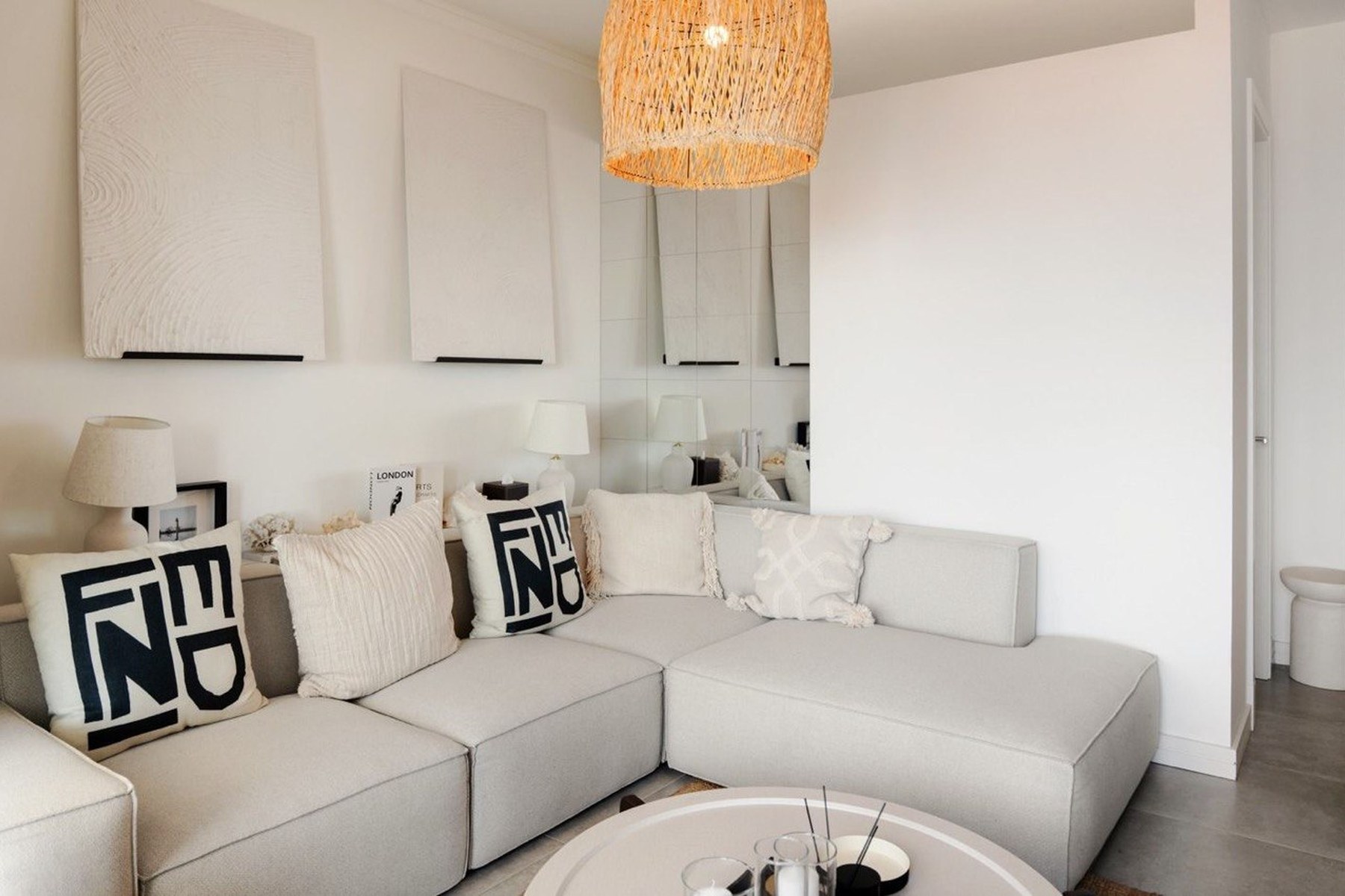 Marina Village 52 m² apartment, living-room sofa detail in coastal styling