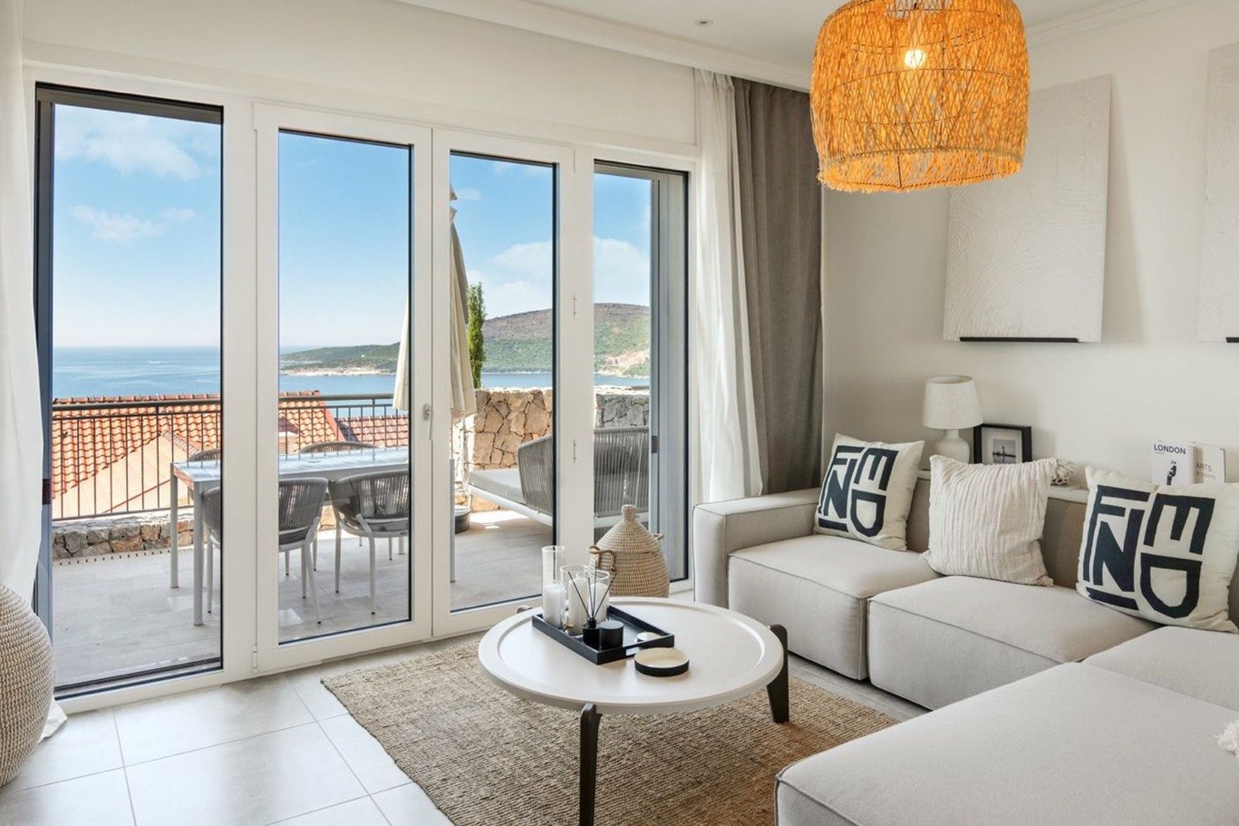 Marina Village 52 m² apartment, living room opening onto the sea-view terrace