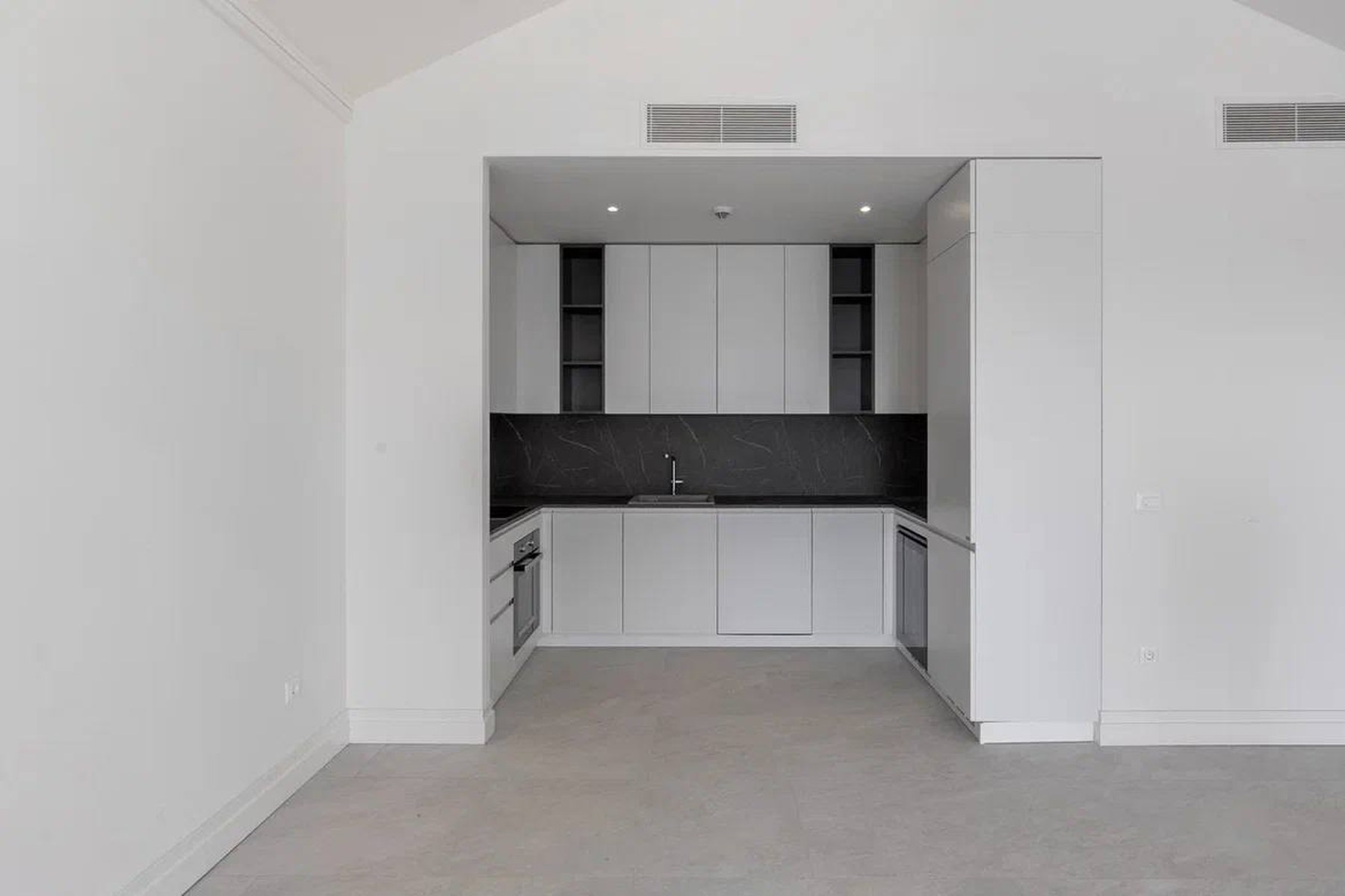Marina Village 94 m² top-floor apartment, open modern kitchen in monochrome finish