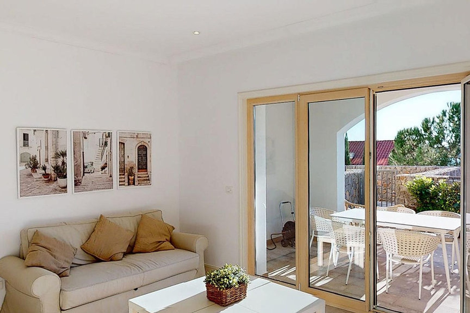 Marina Village garden one-bedroom residence, living-dining view onto the terrace