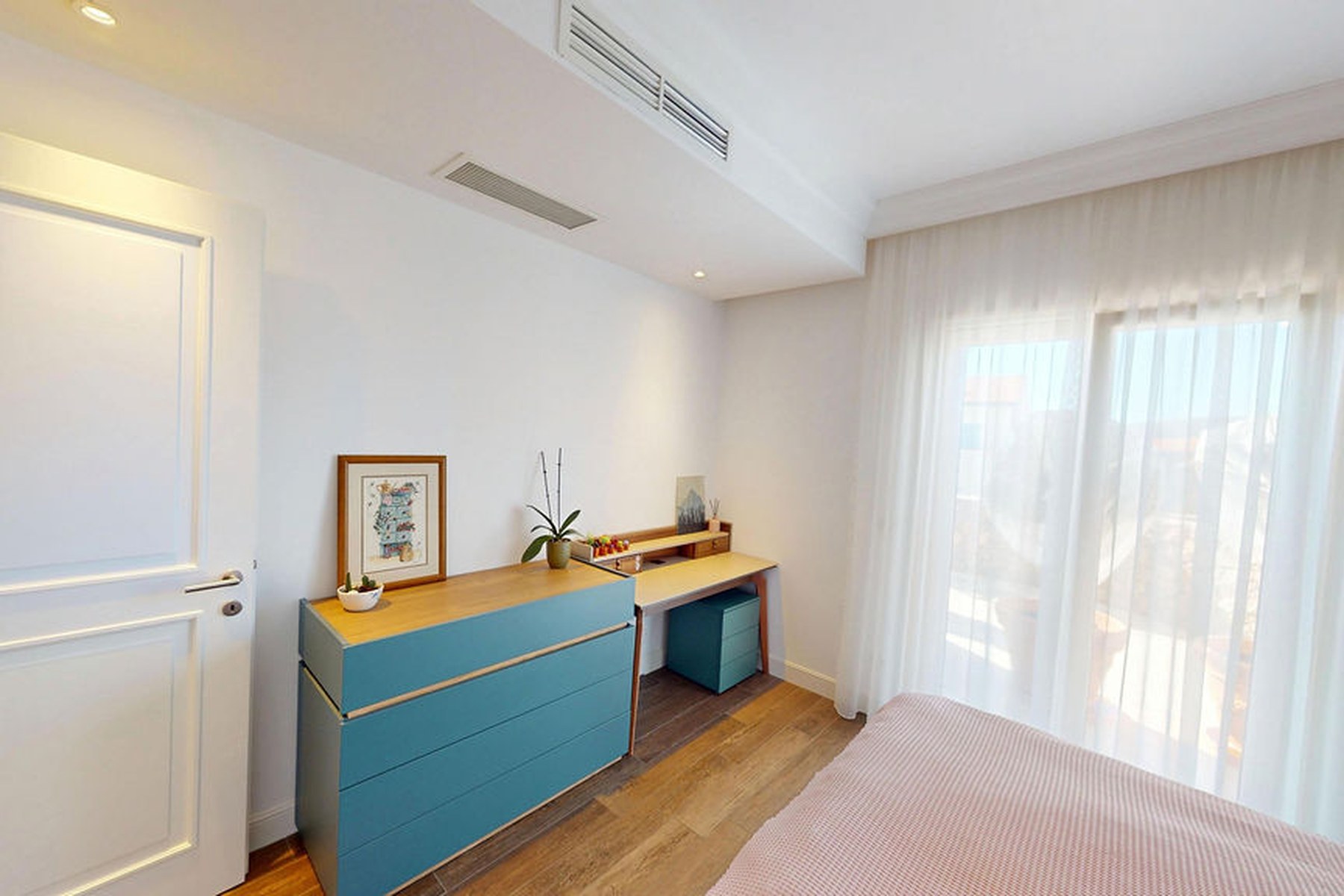 Ground-floor garden one-bedroom apartment, second room used as a study with teal storage